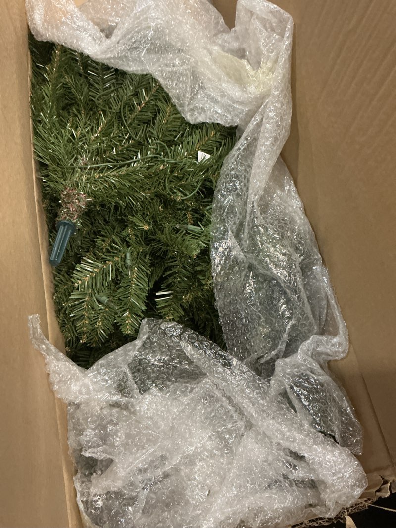 Condition photo showing As Is for puleo international 6.5ft pre-lit fraser fir pencil christmas tree with 250 clear lights, 826 realistic dense branch tips, easy setup artificial trees with sturdy metal stand 6.5' pencil fraser fir with 250 clear lights
