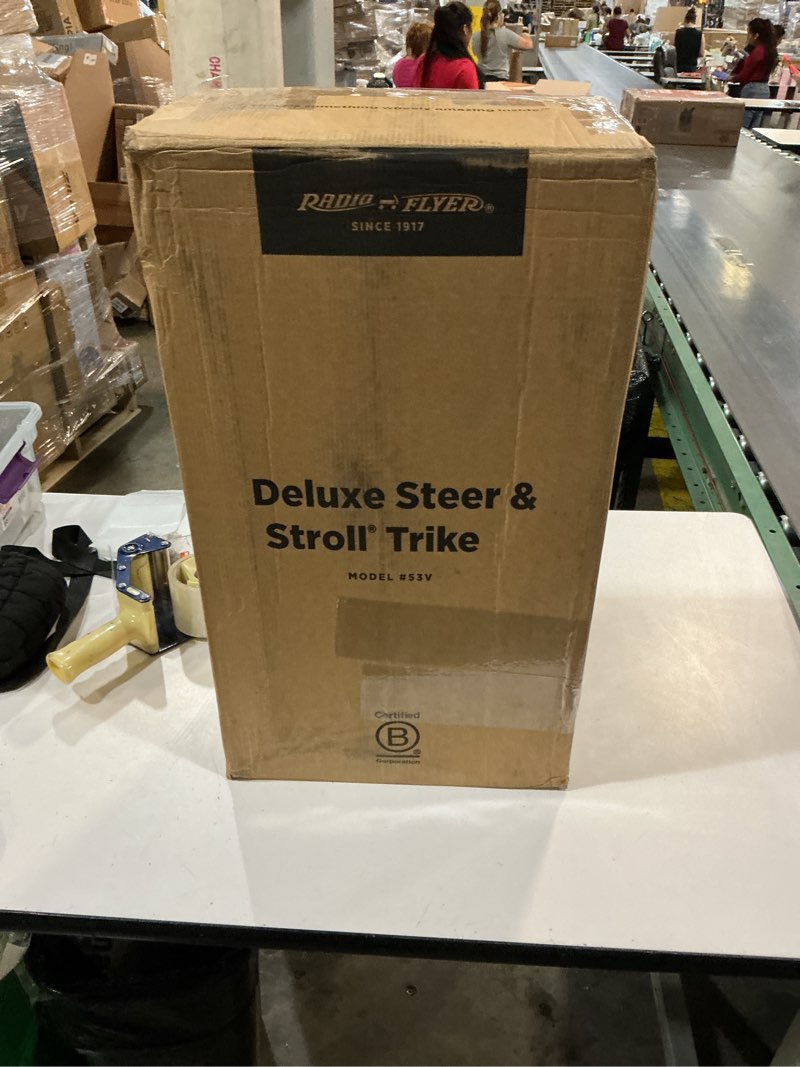 Condition photo showing New/Like New for radio flyer deluxe steer & stroll trike, red, for kids 2-5, 2-in-1 parent steer tricycle, removable push handle, adjustable seat, steel frame, covered storage bin, tricycle for toddlers and kids