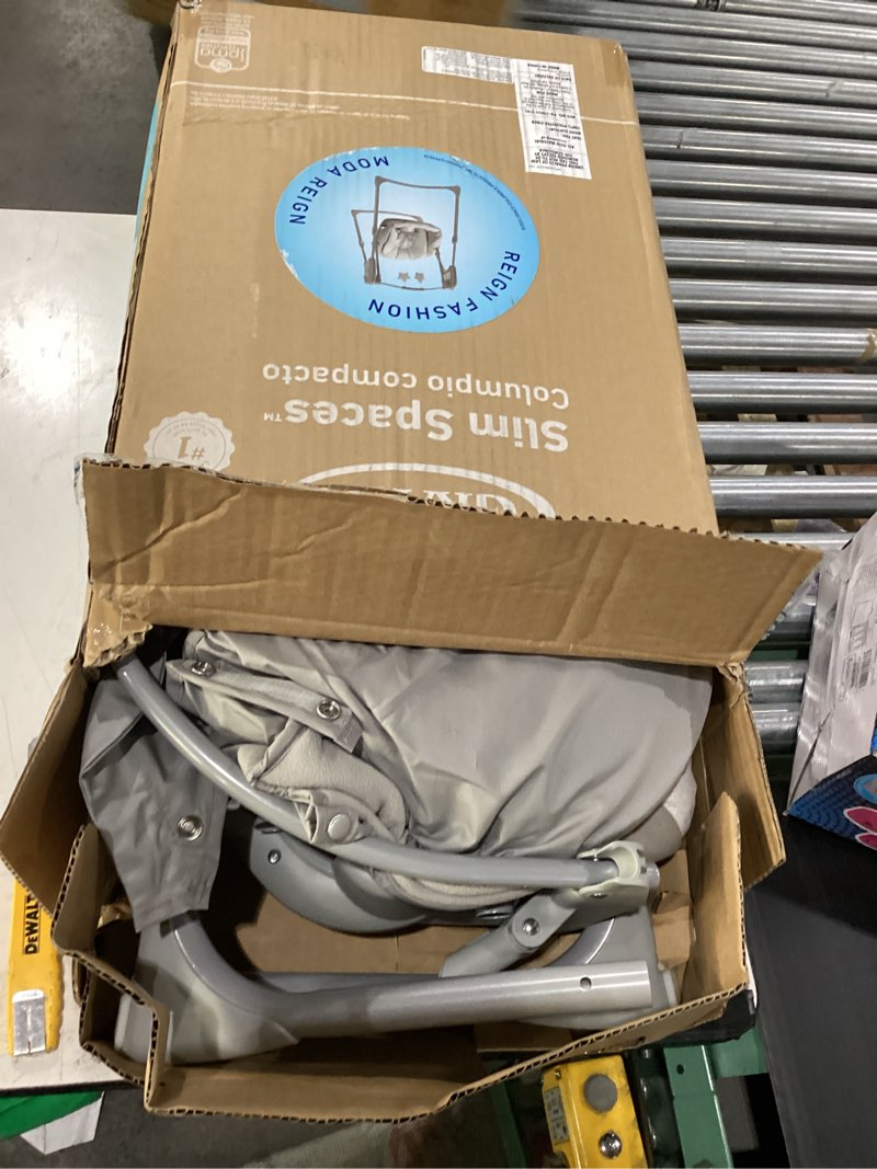 Condition photo showing As Is for graco slim spaces compact baby swing, space saving portable bay swing with height adjustable legs & soft toys, reign