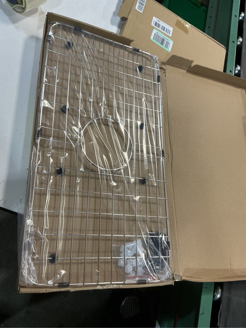 Condition photo showing New/Like New for serene valley sink bottom grid 24-1/8" x 12-5/8", centered drain with corner radius 1-1/2", sink protector nlw2412c