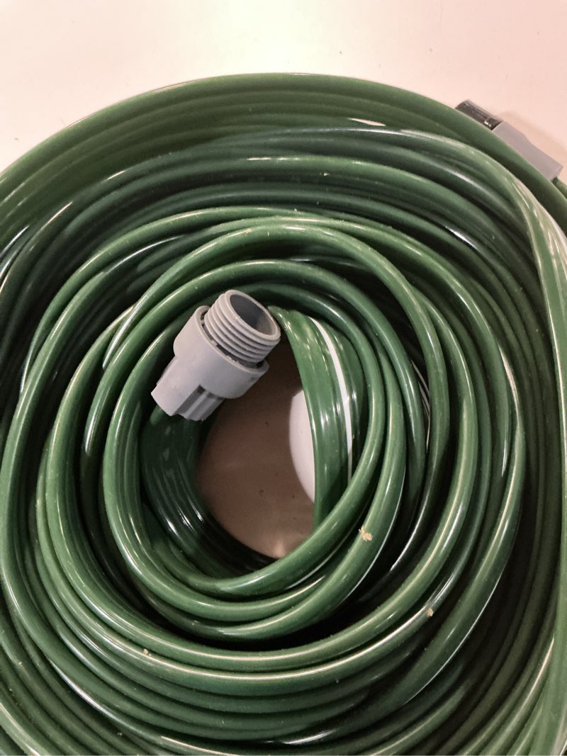 Condition photo showing As Is for watoo 2026 sprinkler hose & soaker hose for yard - 50 ft reinforced flat garden hose with holes, heavy duty no-kink lawn irrigation hose (includes stakes, high pressure spray) 50ft