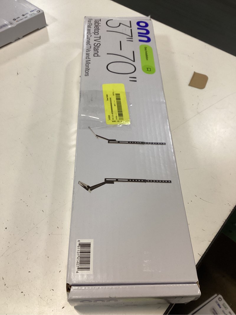 Condition photo showing New/Like New for onn tabletop tv stand for 37" to 70" tvs, holds up to 110 lbs, black- metal legs for tabletop