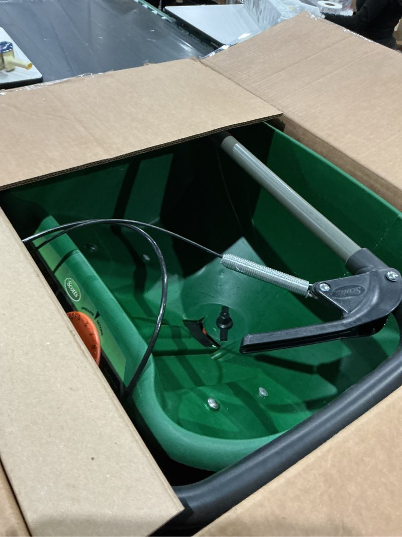 Condition photo showing As Is for scotts turf builder edgeguard dlx broadcast spreader for seed, fertilizer, salt, ice melt, holds up to 15,000 sq.ft. product deluxe
