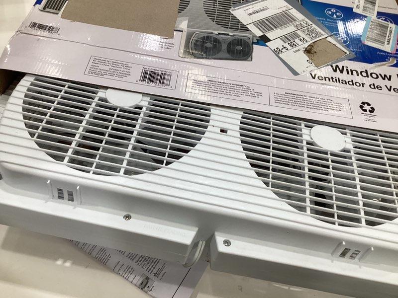 Condition photo showing As Is for comfort zone 9  twin window fan with quiet setting  reversible airflow control  3-speeds  expandable  exhaust  dual fan  airflow 9.84 ft/sec  ideal for home  kitchen  bedroom & office  cz319wt2