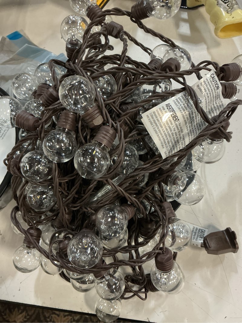Condition photo showing As Is for harbor breeze 48-ft plug-in brown indoor/outdoor string light with 100 white -light led globe bulbs