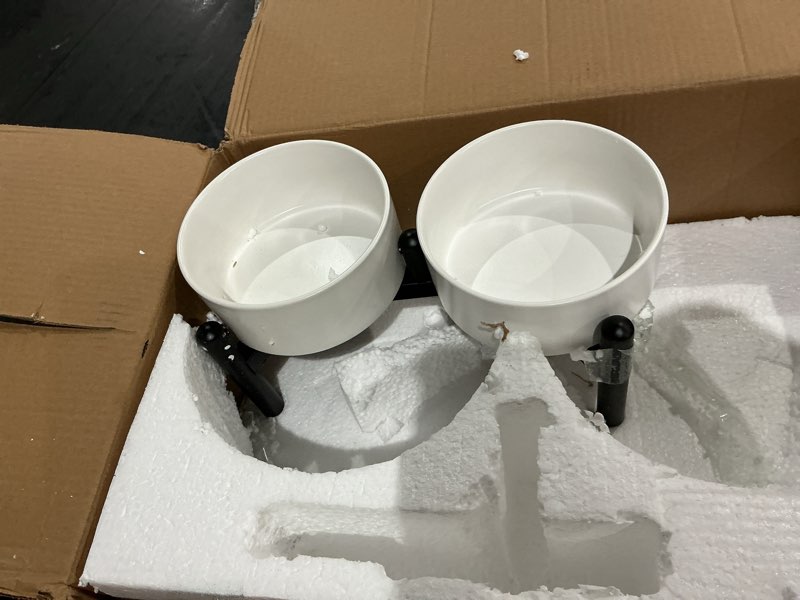 Condition photo showing Good Condition for raised ceramic dog bowl set - elevated double dishes with stainless steel stand - food and water bowls for small to medium dogs - each holds 2 cups (28.75 fl oz) - white medium white