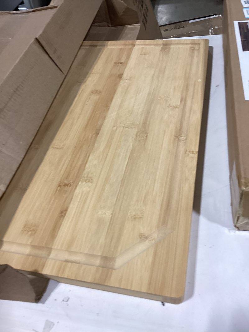 Condition photo showing Good Condition for 24 x 18 extra large bamboo serving boards for kitchen, heavy duty wood butcher block chopping board with handle and juice groove for meat, large charcuterie board, over the sink cutting board natural bamboo 24"l x 18"w | single board