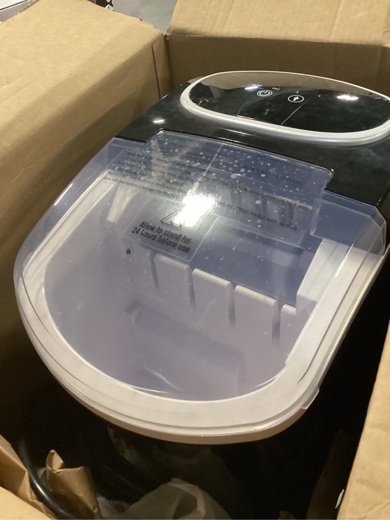 Condition photo showing As Is for OLIXIS Ice Maker Machine with Handle,26lbs in 24Hrs,9 Ice Cubes in 6 Mins,Auto-Cleaning Portable Ice Maker with Basket and Scoop, Countertop Ice Maker for Home/Kitchen/Camping/RV, Sleek Black Sleek Black Handle-26.5Lbs/24H