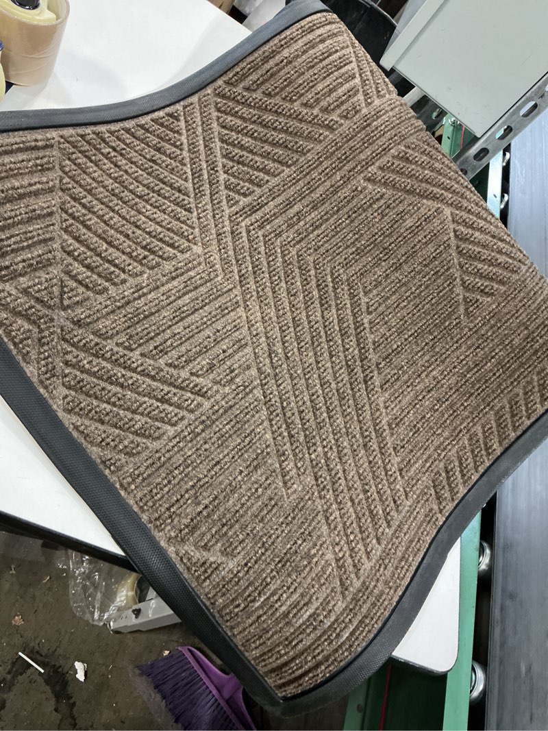 Condition photo showing As Is for Smiry Front Door Mat Outside Entrance, Heavy Duty Sturdy Natural Rubber Doormat, Trap Dirt and Moisture, Easy Clean Low Profile Mats for Indoor Outdoor Entry, Irregular Triangle (29.5x17, Brown