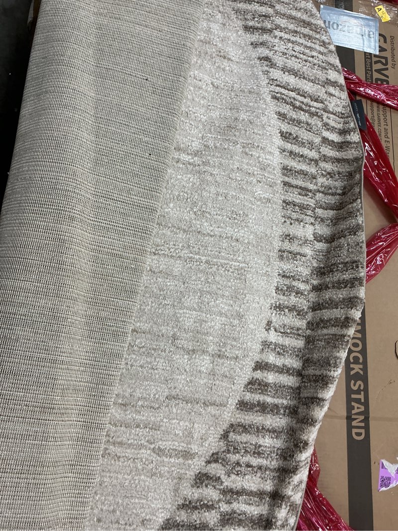 Condition photo showing As Is for round loloi chris loves julia calvin collection clv-04 ivory/pebble 7'-10\" x 7'-10\" round area rug checkered neutral soft living room bedroom carpet ivory / pebble 7'10\" (round)