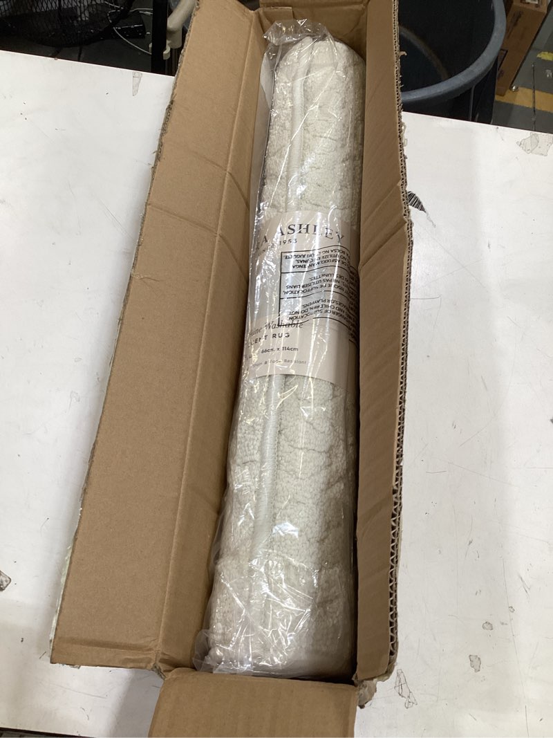Condition photo showing Good Condition for laura ashley hi-low tufted 26" x 45" washable skid-resistant accent rug - ivory austell solid