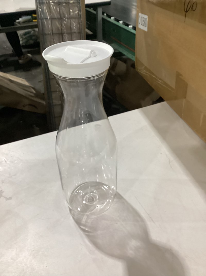 Condition photo showing New/Like New for gejoy 24 pcs plastic water carafe with lids 32 oz clear juice pitchers for mimosa bar drinks milk iced tea beverage containers for home restaurant school fridge, not dishwasher safe (white cap) 24 white cap