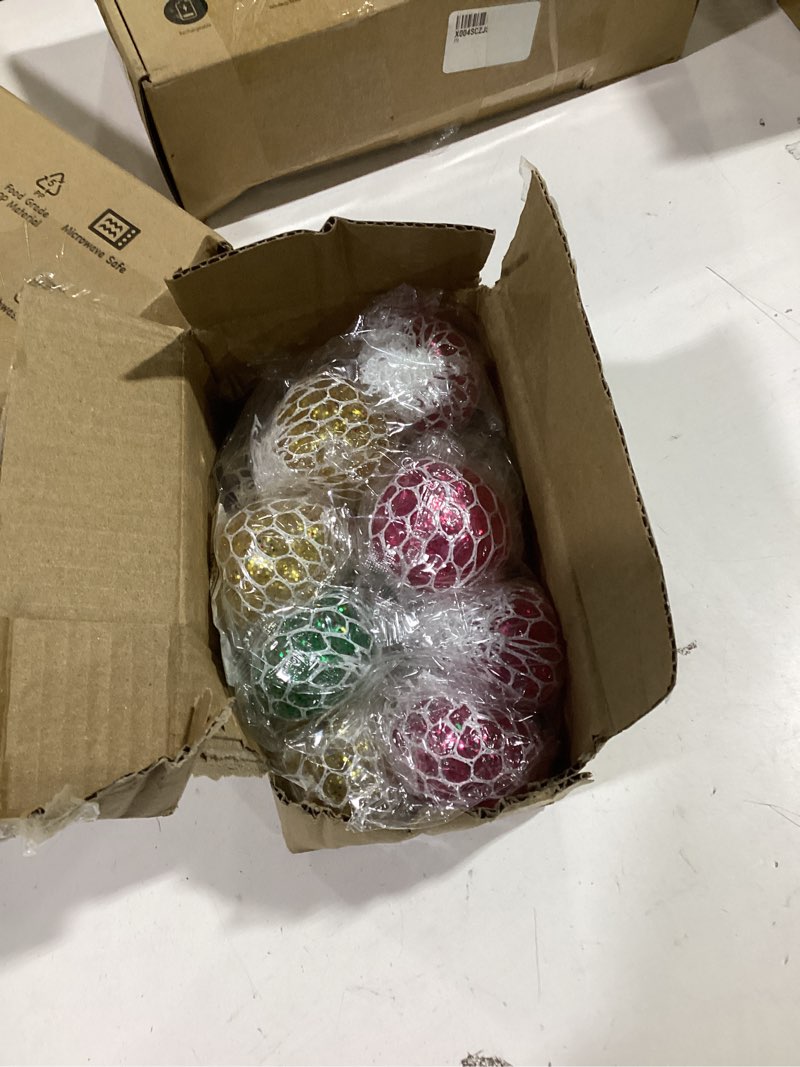 Condition photo showing As Is for 24 Pack Stress Balls Set Fidget Toys for Kids,Christmas Party Favors for Boys Girls School Class Birthday Gifts,Squeeze Balls Bulk,Game Prizes and Goodie Bag Christmas Stocking Stuffers Filler Mesh Glitter Stress Balls