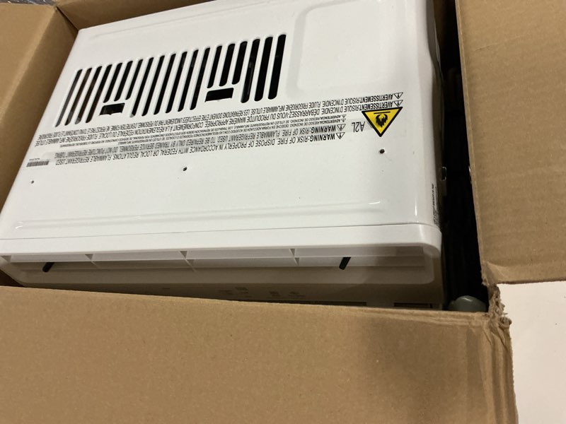 Condition photo showing As Is for LG 5,000 BTU Window Air Conditioner, Cools 150 Sq.Ft. (10' x 15' Room Size), Quiet Operation, Electronic Control AC Unit with Remote, 2 Cooling & Fan Speeds, 2-Way Air Deflection, Auto Restart, 115V