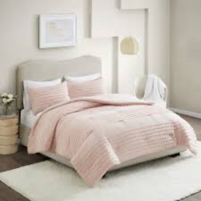 The Comfort Spaces Phillips Cotton Jacquard Comforter Set offers a charming and comfortable update to your bedroom décor. This blush comforter features a striped jacquard fabric woven with cotton dots that add texture and dimension to the face of the bed. A solid microfiber reverse provides additional comfort, while two matching shams with overlap closures on the back complete the jacquard comforter set. The polyester filling provides exceptional warmth and comfort. Machine washable for easy care, this cotton jacquard comforter set creates a cozy and chic look in your bedroom.