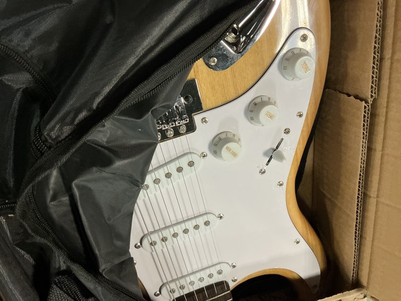 Condition photo showing As Is for Pyle Electric Guitar and Amp Kit - Full Size 39" Complete Starter Kit with Wearable Bluetooth Amplifier, 1/4” Cable, Carry Case, Strap, Strings, Picks, Cleaning Cloth, ST-Style Pickups (Black) Black ST Style