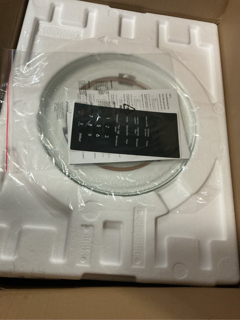 Condition photo showing As Is for Frigidaire 0.9 Cu. Ft. Countertop Microwave Oven  Stainless Steel