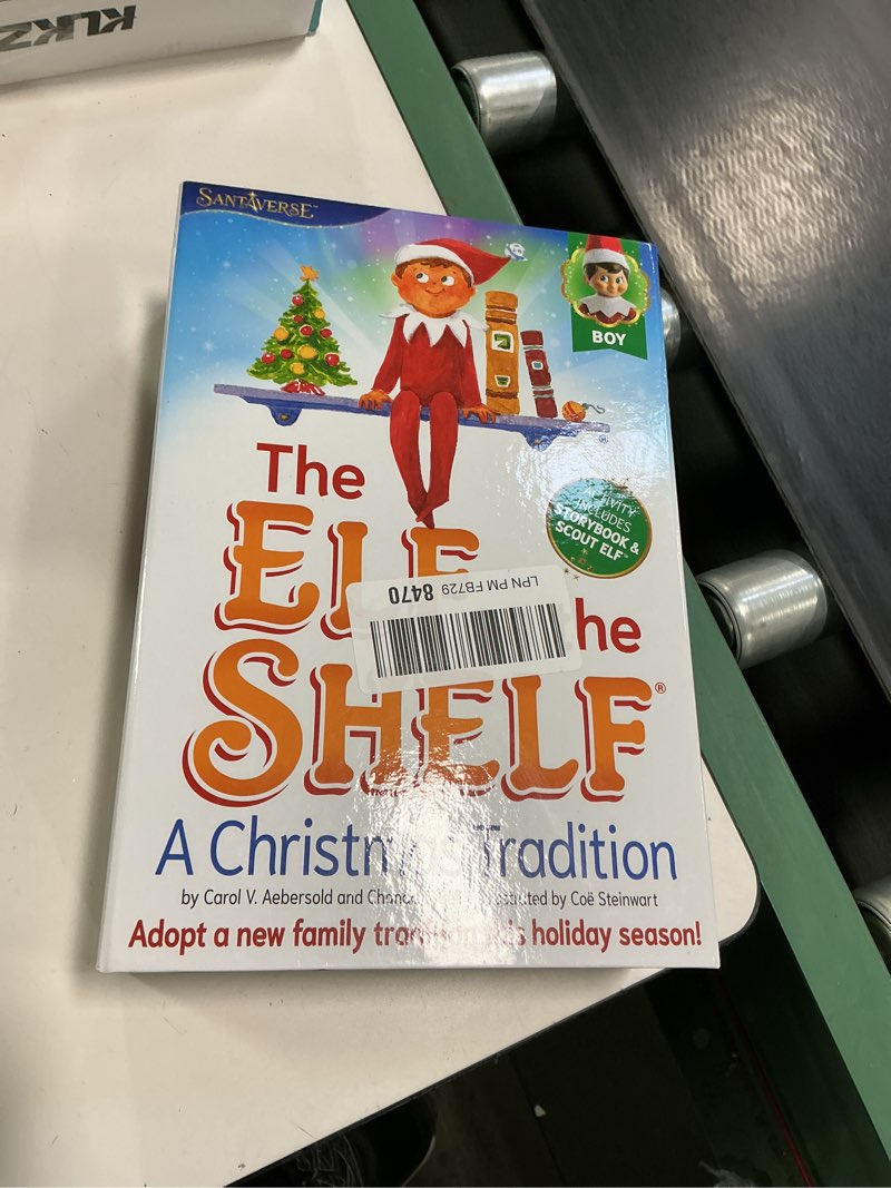 Condition photo showing New/Like New for The Elf on the Shelf: A Christmas Tradition - Boy Scout Elf with Blue Eyes - Includes Artfully Illustrated Storybook, Keepsake Box and Official Adoption Certificate Blue-eyed Boy
