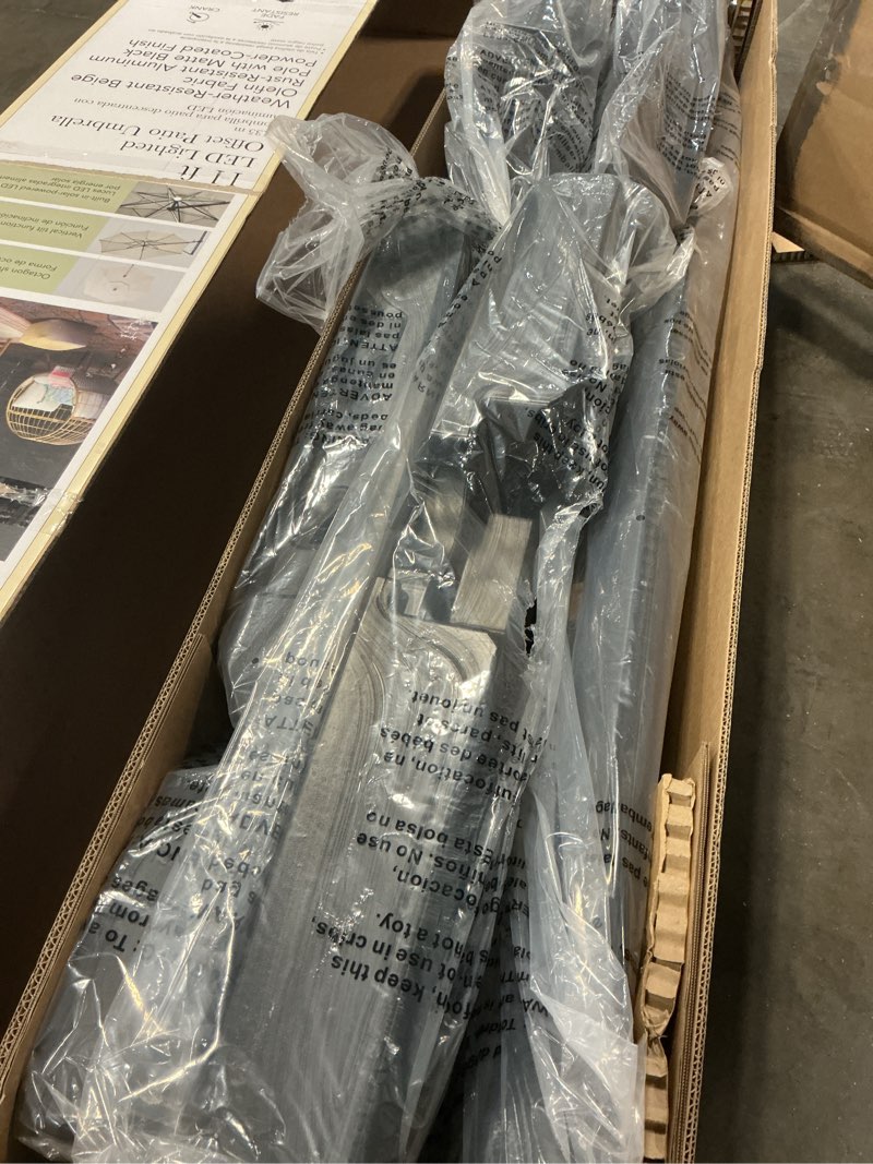 Condition photo showing New/Like New for allen + roth 11-ft aluminum beige slide-tilt cantilever patio umbrella with lights with base