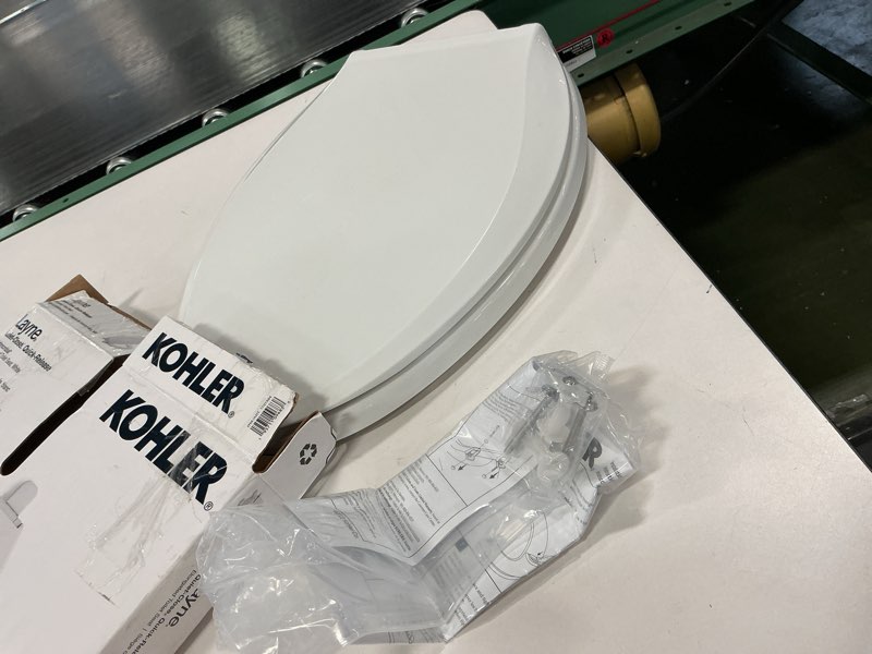 Condition photo showing As Is for Kohler Layne quiet close elongated toilet seat