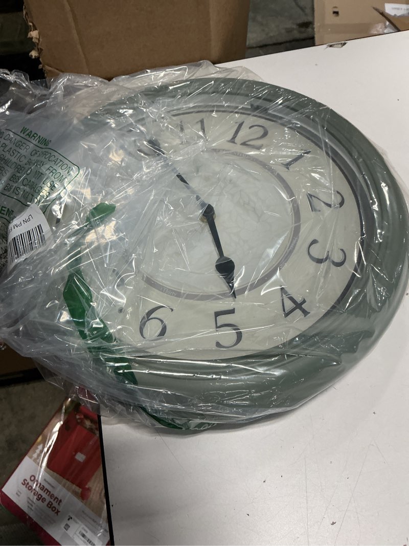 Condition photo showing Good Condition for Presentime & Co. 12.6" Illuminated Farmhouse Wall Clock, Silent Battery Operated Night Light Wall Clock with Smart LED Sensor for Living Room, Bathroom, Kitchen, Home Office, Sage Green 12.6" Sage Green