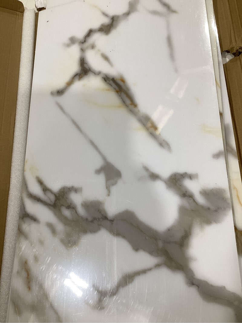 Condition photo showing Good Condition for 10-Sheet Subway Peel and Stick Backsplash, 12" x 24" Glossy Calacatta Gold Acrylic Self Adhesive Waterproof Wall Stickers, Stick on Tiles for Kitchen Bathroom Shower Calacatta Gold 12" x 24" (10 Sheets)