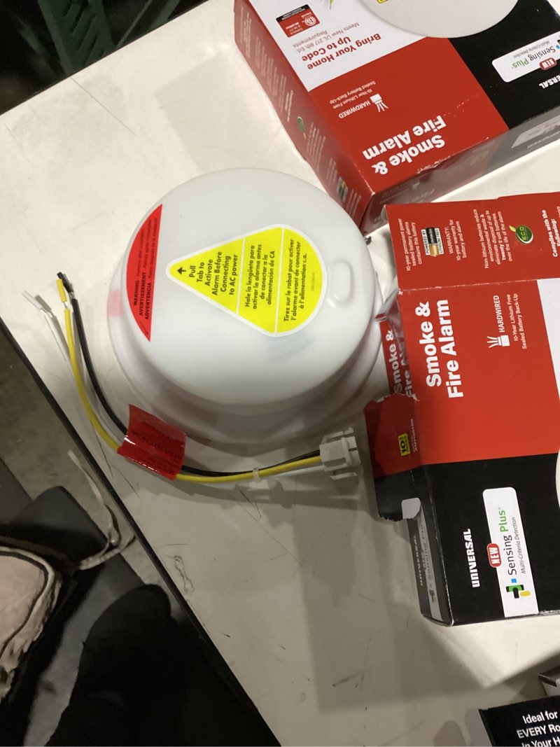 Condition photo showing New/Like New for usi sensing plus hard-wired w/battery back-up ionization/photoelectric smoke/fire detector 1 pk