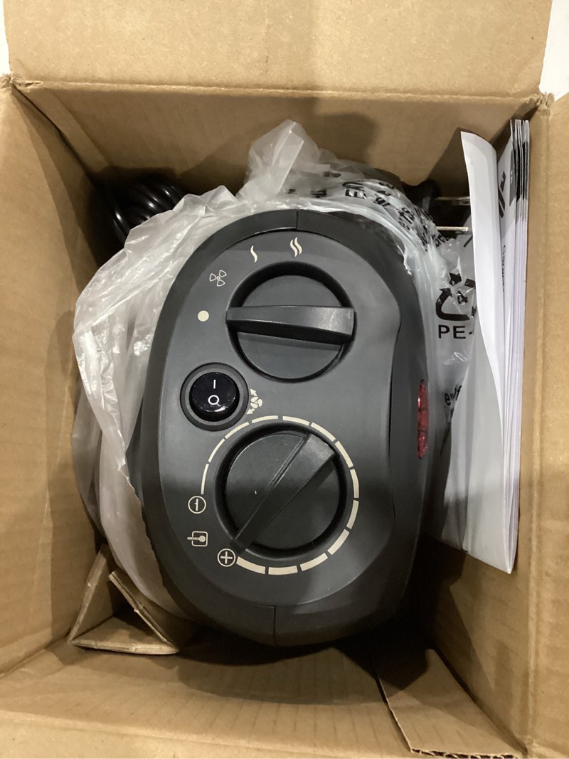 Condition photo showing As Is for Amazon Basics Oscillating Ceramic Space Heater, Portable Indoor Heating Solution, With Overheat and Tip-Over Protection, Thermostat, 1500W, 7.52"D x 6.34"W x 9.45"H, Black Oscillating black