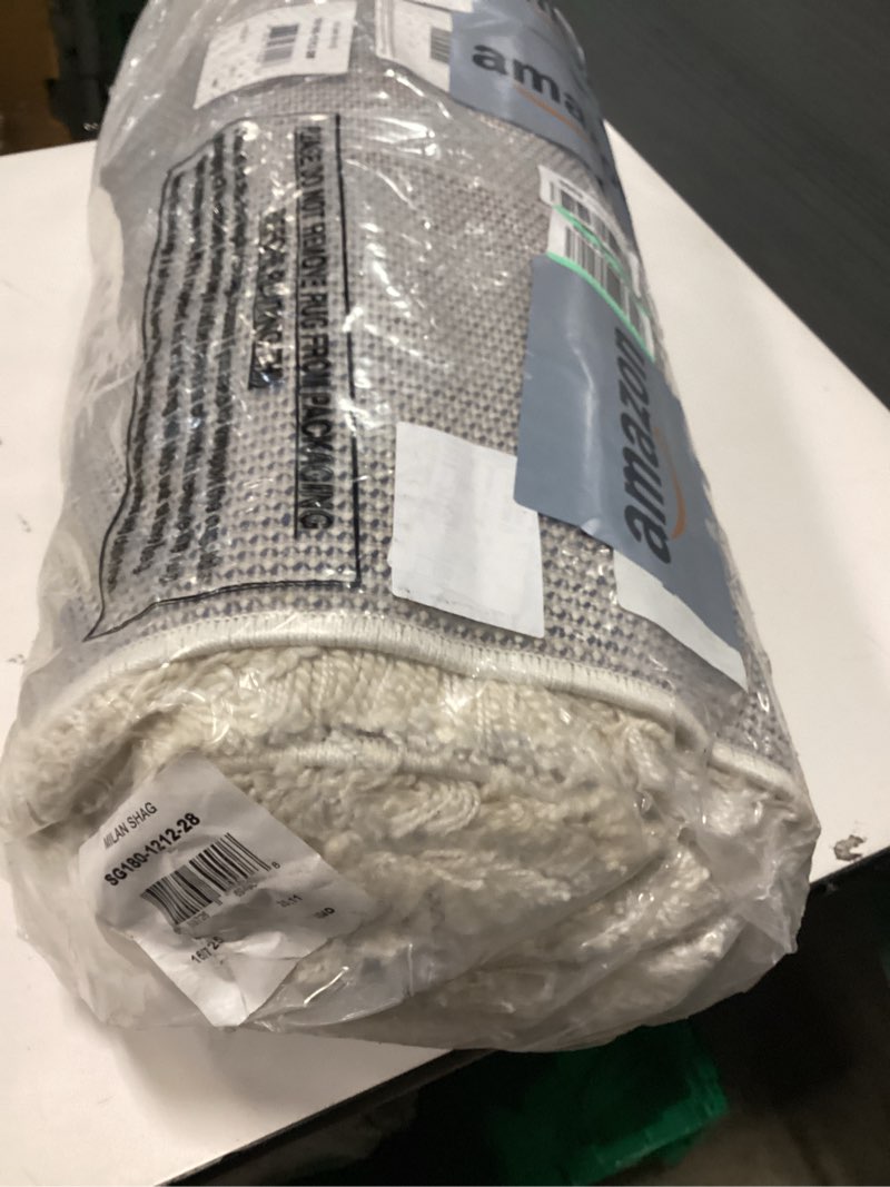 Condition photo showing Good Condition for SAFAVIEH Milan Harlow Solid Plush Shag Runner Rug  Ivory  2  x 8