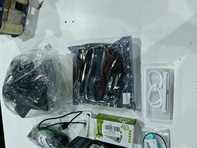 Condition photo showing As Is for assorted lot of electronics (headphones, small gadgets, headsets, etc.) 