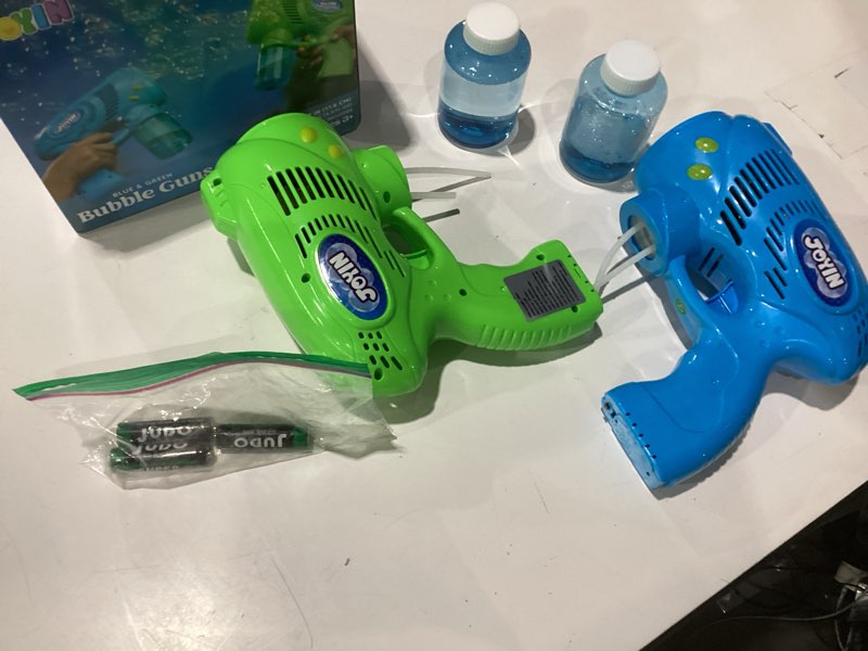 Condition photo showing As Is for joyin 2 kids bubble gun with 2 bottles refill solution, bubble machine gun for toddlers 1-3 kids 4-8, party favors, summer toy, outdoors, easter, birthday gift blue+green