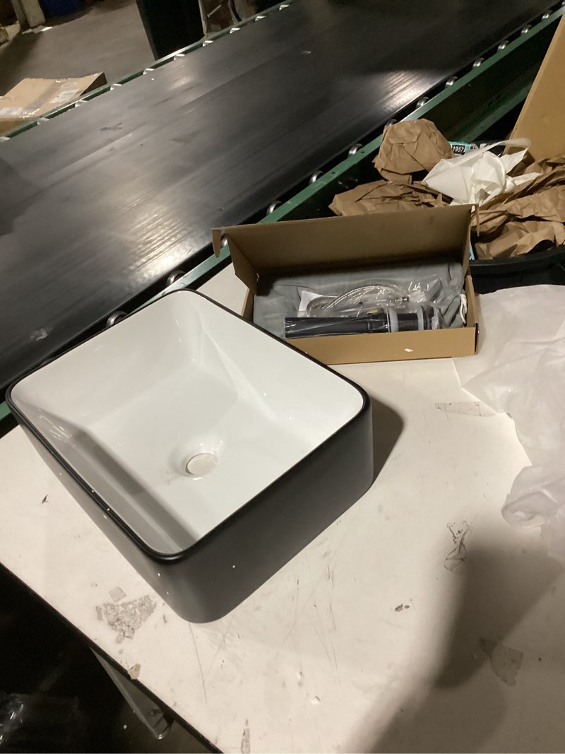 Condition photo showing Good Condition for ceramic bathroom sink, black and white 19" x 15" above counter porcelain vessel sink with black faucet and pop up drain set, rectangle