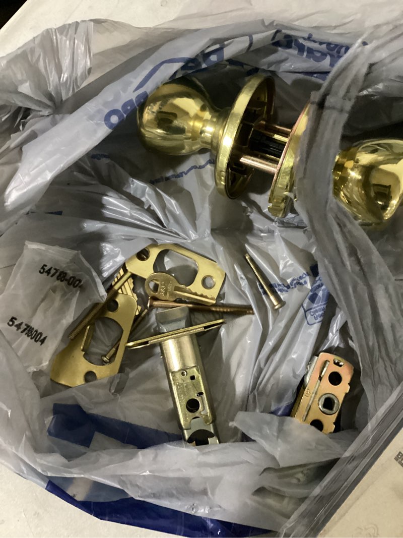 Condition photo showing As Is for kwikset tylo polished brass deadbolt and passage door knob 1-3/4 in.
