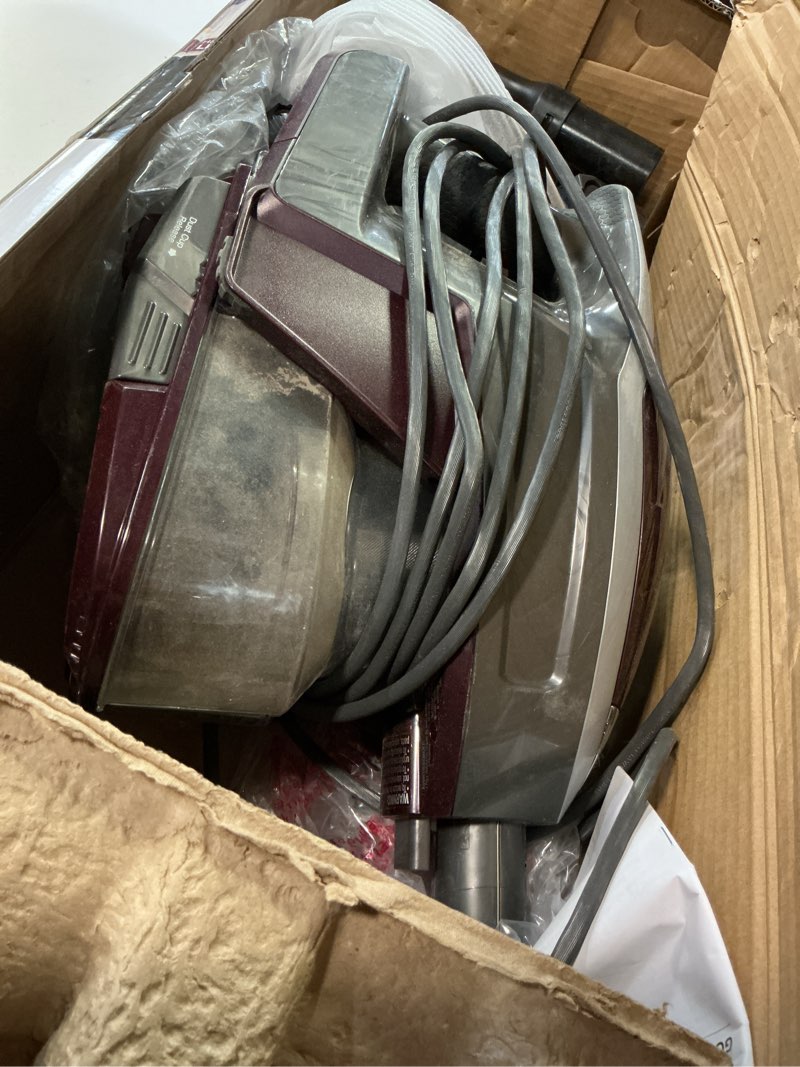 Condition photo showing As Is for shark hv322 rocket pet plus corded stick vacuum with led headlights, xl dust cup, lightweight, perfect for pet hair pickup, converts to a hand vacuum, with (2) pet attachments, bordeaux/silver rocket deluxe w/ headlights