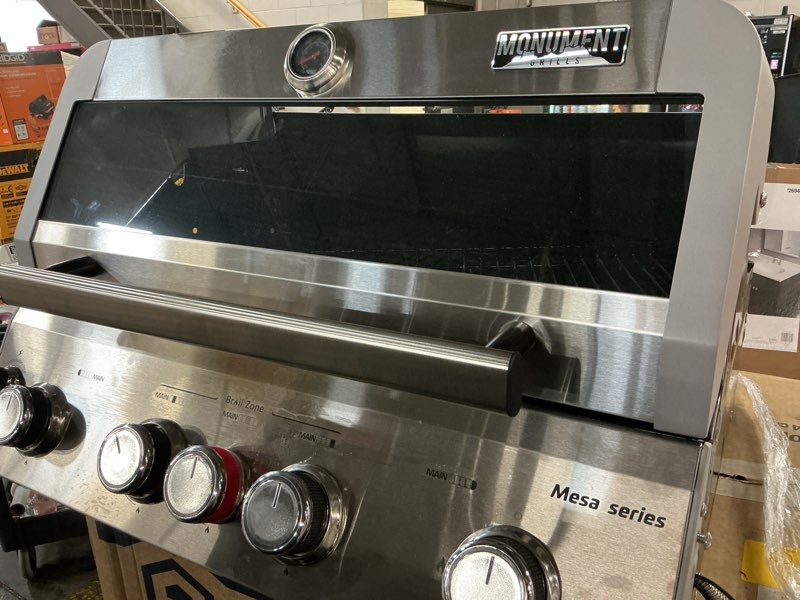 Condition photo showing As Is for (incomplete)mesa 5-burner natural gas grill in stainless steel with broil zone, clear view lid, and led controls
