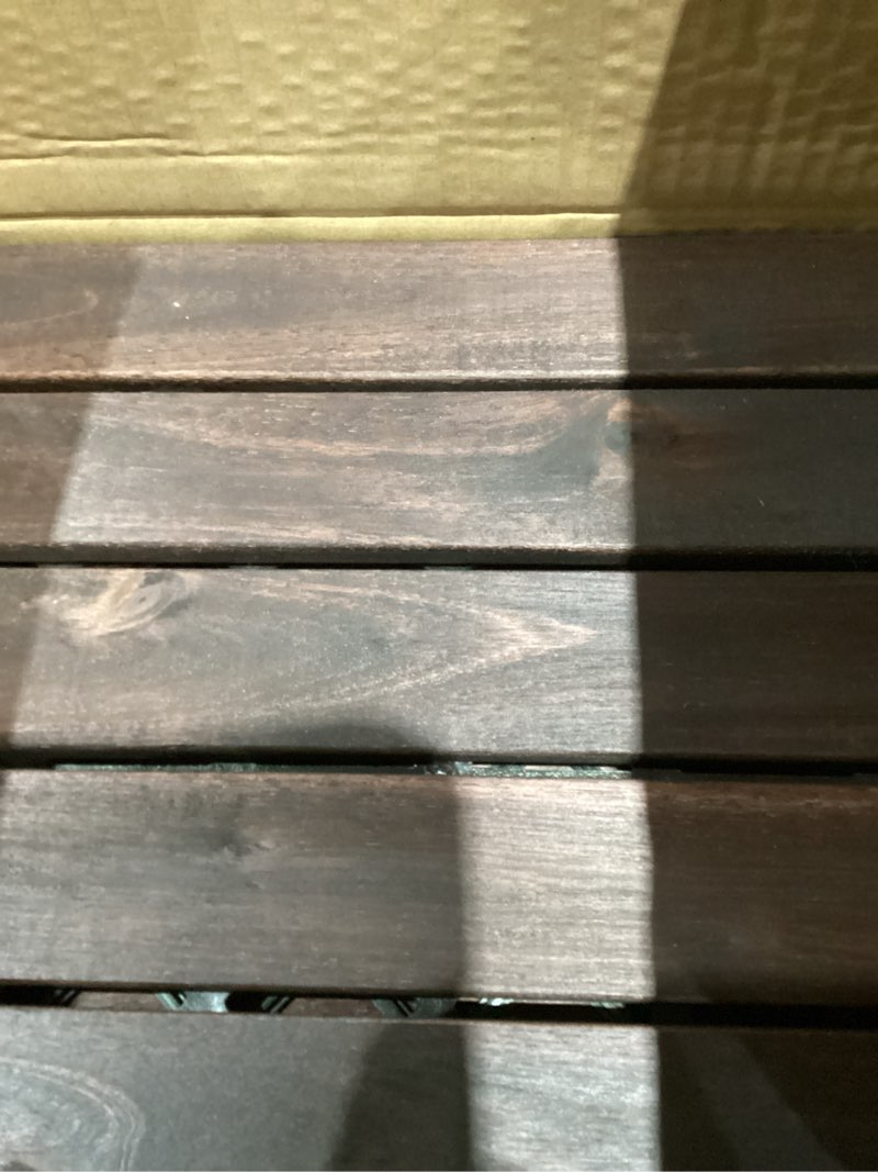 Condition photo showing Good Condition for idzo interlocking deck tiles 9.6 sqft - 10pcs waterproof acacia wood patio tiles, flooring tiles for indoor and outdoor - decking stripe pattern, 11.81 x 11.81 x 0.91 inches, dark brown dark brown striped pattern