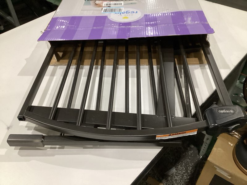 Condition photo showing Good Condition for (USED) Regalo 58-Inch Easy Step Extra Tall Arched Décor Walk Thru Baby Gate, Award Winning Brand, Includes 4-Inch Extension Kit, 4 Pack Pressure Mount Kit and 4 Pack Wall Mount Kit, Bronze Black - 29-58\"w X 30\"h