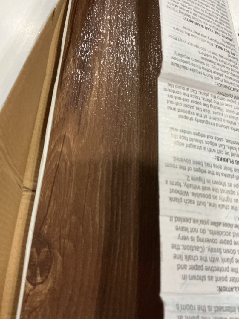 Condition photo showing Good Condition for Sterling Vinyl Plank Flooring 1.2mm, 10 Planks - 6" x 36", Saddle - No Adhesive Needed, Embossed DIY Flooring - Natural Wood Grain Feel for Kitchen, Dining Room, & Bedrooms by Achim Home Décor Sandlewood 10 Planks