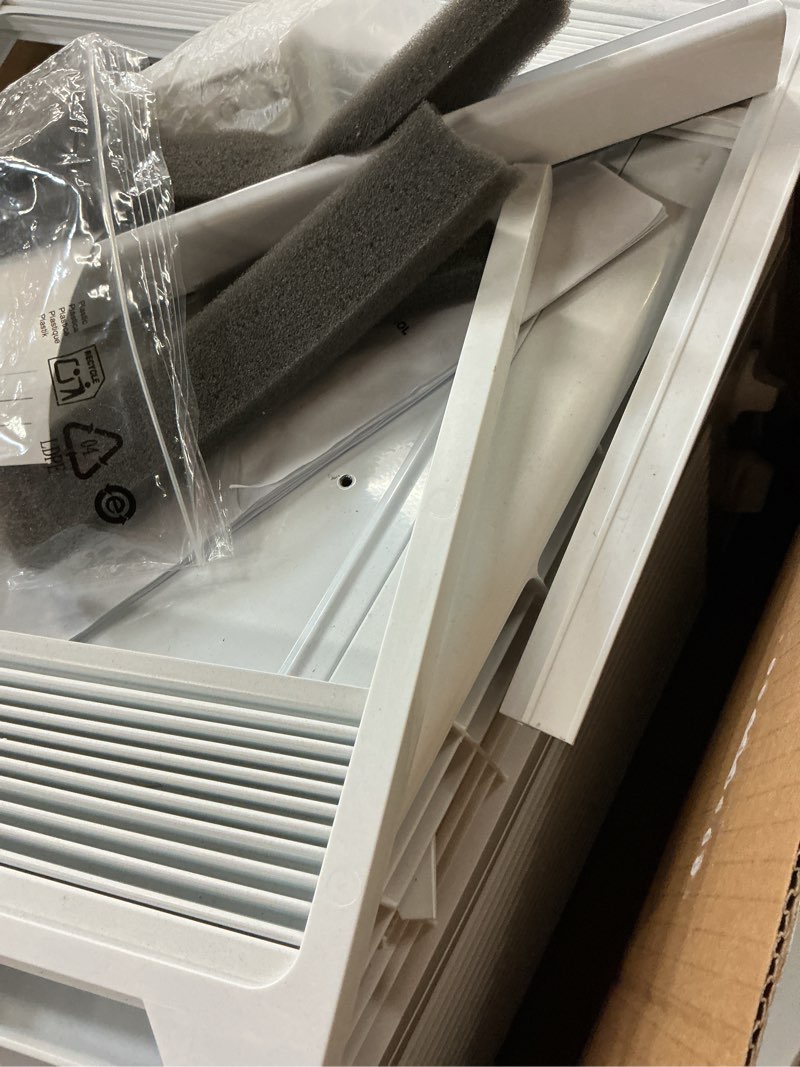 Condition photo showing As Is for ge appliances 5000 btu mechanical window air conditioner unit