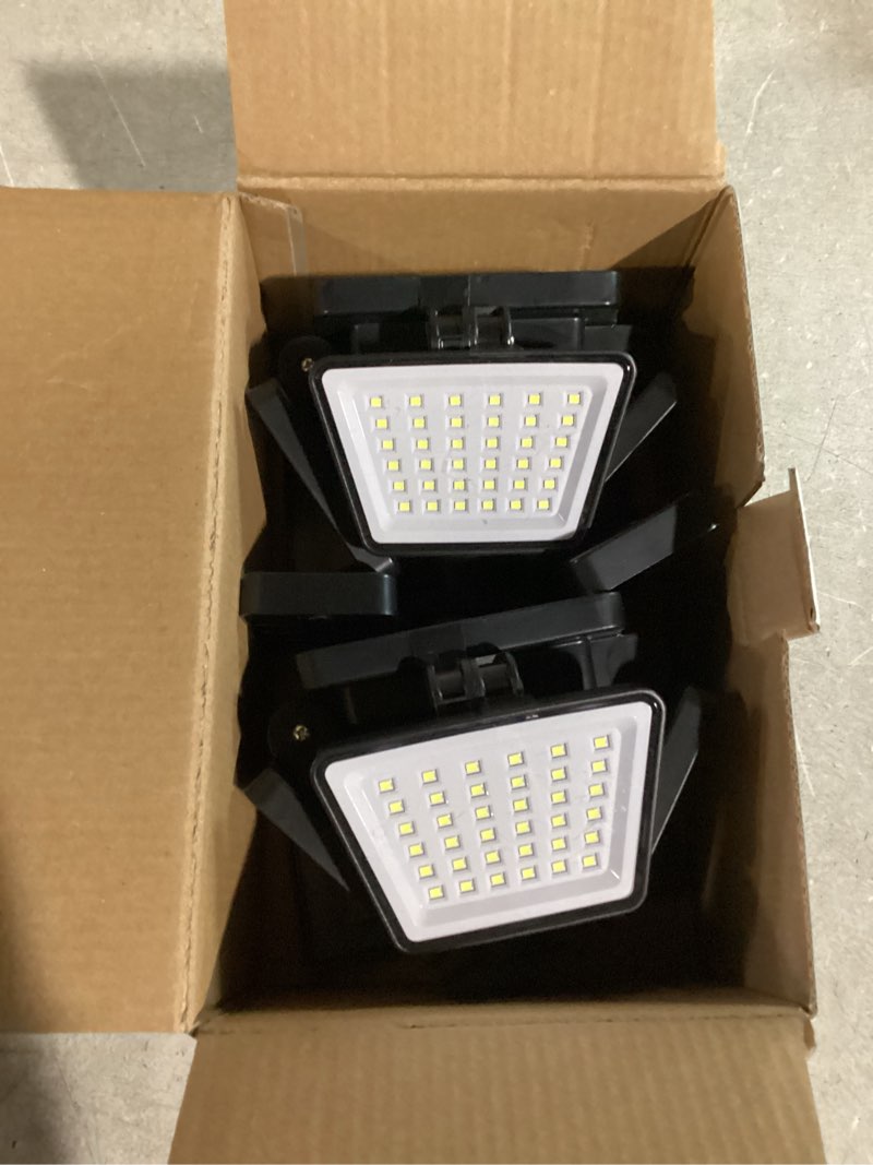 Condition photo showing Good Condition for 3000LM Solar Lights Outdoor with Motion Sensor,4 Head 270° Wide Angle Street Area Lights,IP65 Waterproof Security Lighting with 3 Modes(Remote,2 Pcs) 4Head-2 Pcs