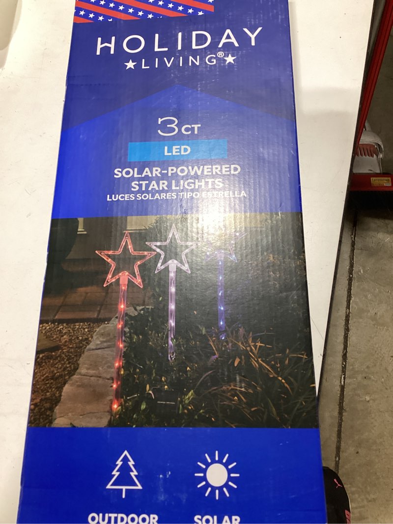 Condition photo showing As Is for 3 ct holiday living solar power red white and blue stars