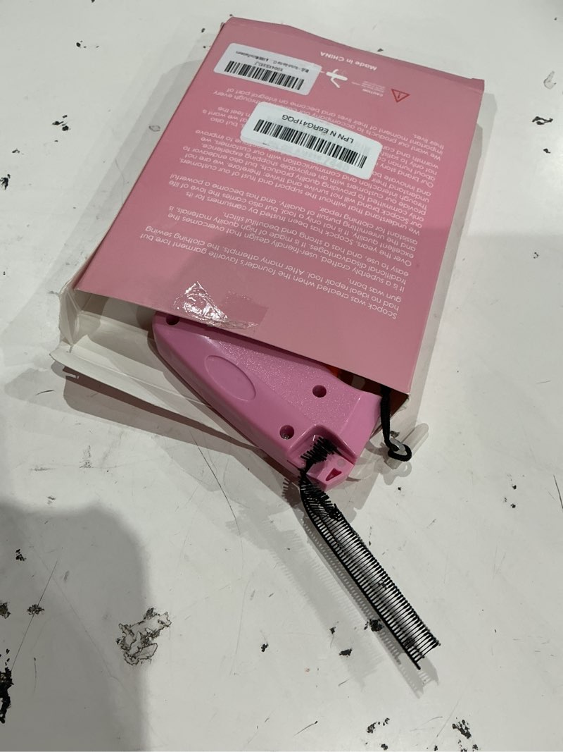 Condition photo showing As Is for stitch gun for clothes - handheld stitch gun quick clothing fixer - tagging gun - includes 6 needle, 1000 black fasteners & 1000 white fasteners pink,orange