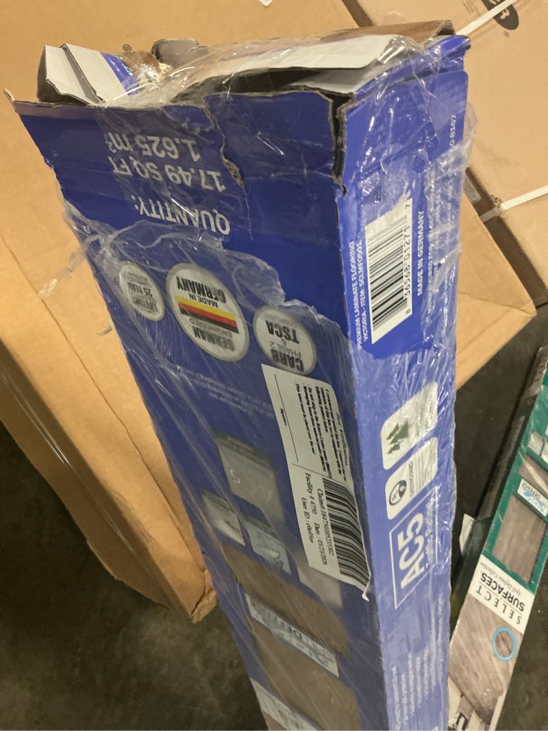 Condition photo showing As Is for select surfaces victoria spilldefense laminate flooring, 17.49 sq. ft. per box