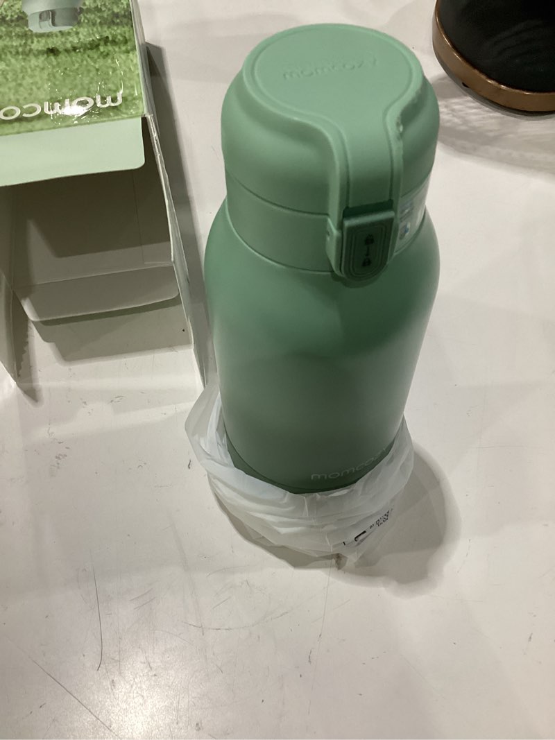 Condition photo showing As Is for momcozy portable bottle warmer for travel – dual heating modes for breast milk & water, portable milk warmer with fast heating & long battery life, 17 ounces large capacity to meet your all-day needs gradual change of green
