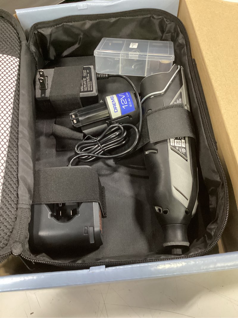 Condition photo showing Good Condition for 12v li-ion 2-amp variable speed cordless rotary tool kit with 2ah battery, 1 charger, 5 accessories and storage bag