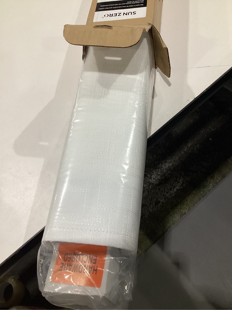 Condition photo showing Good Condition for Sun Zero Seraphina Textured Total Blackout Cordless Roman Shade, 39" x 64", White White 39"W x 64"H