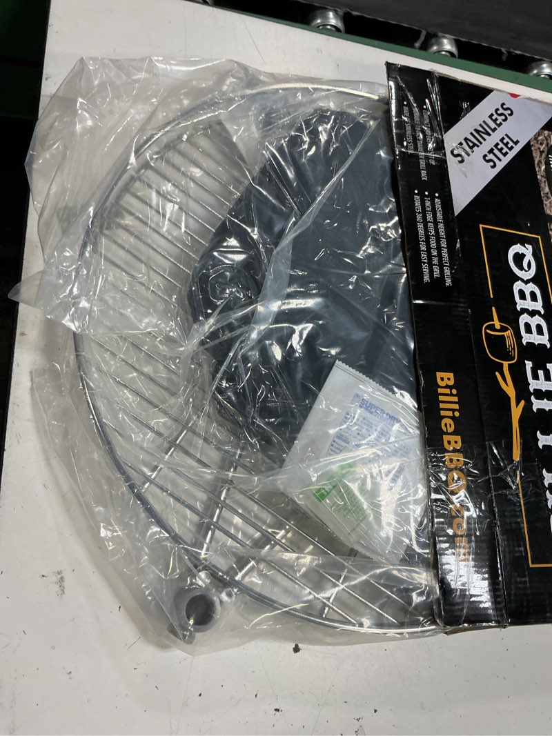 Condition photo showing New/Like New for portable orb campfire grill, 18" dia, hd stainless steel rack with 2 piece stake, free carrying bag,