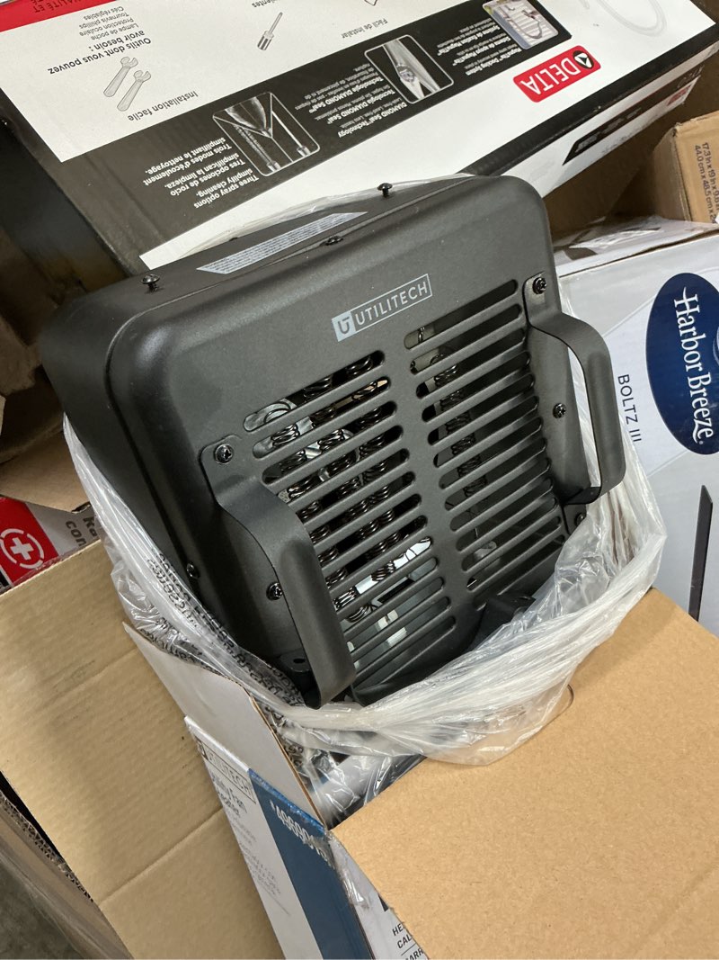 Condition photo showing As Is for utilitech utility fan indoor electric space heater