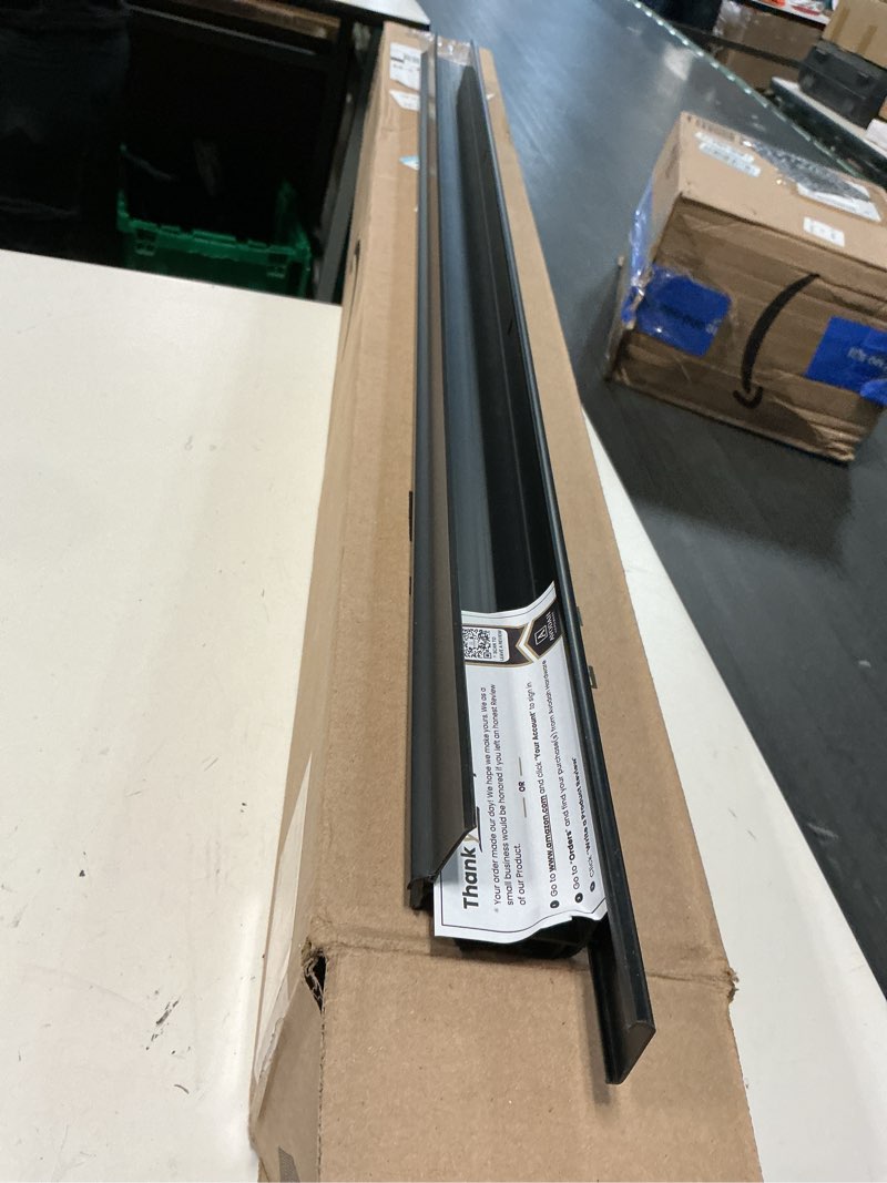 Condition photo showing As Is for 42 inch black, adjustable double bubble door sweep for exterior doors, under door seal with drip edge and punched drainage channel, pre-notched for weatherstripping, trim-to-fit avodah hardware