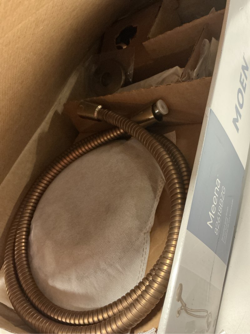 Condition photo showing As Is for moen meena bronzed gold single handle modern shower faucet with handshower and tub spout for bathtub, valve included, 82618bzg